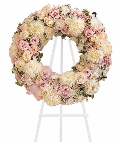 Pink rose and white chrysanthemum open center ring funeral standing spray wreath