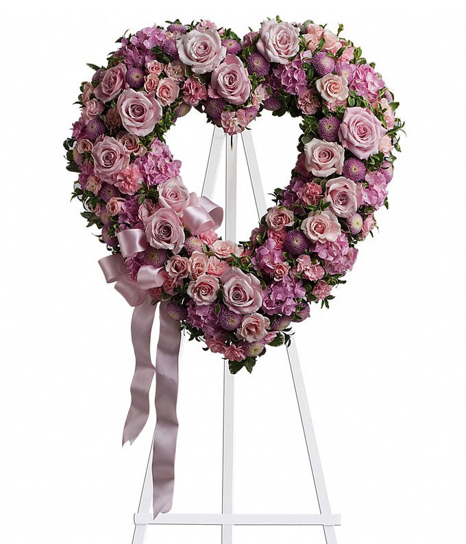Heart-Shaped Flower Arrangement Including Light Pink Roses, Pink Hydrangea, Pink Mini Carnations, and  Lavender Chrysanthemums with Lovely Bow Decoratiin and Stand Included