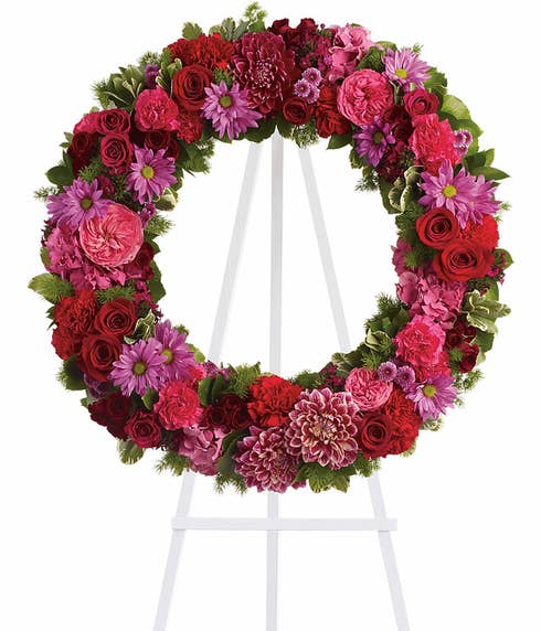 Pink flower funeral ring wreath flower standing spray with easel and dahlias