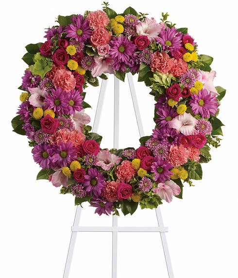 Summer flowers ring wreath funeral flowers standing spray with pink gladioli