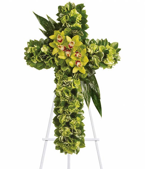 green cymbidium orchid cross shaped funeral flowers standing spray