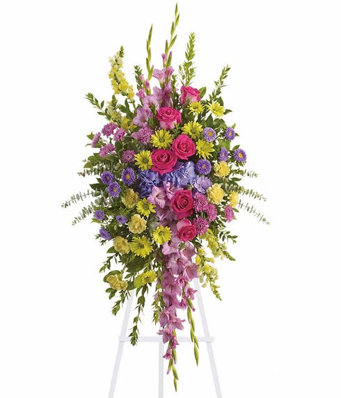 Oval shaped spring flowers funeral standing spray with purple hydrangea and asters