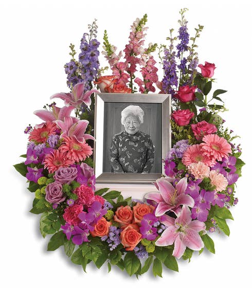 Picture frame funeral flowers arrangement bouquet with pastel flowers