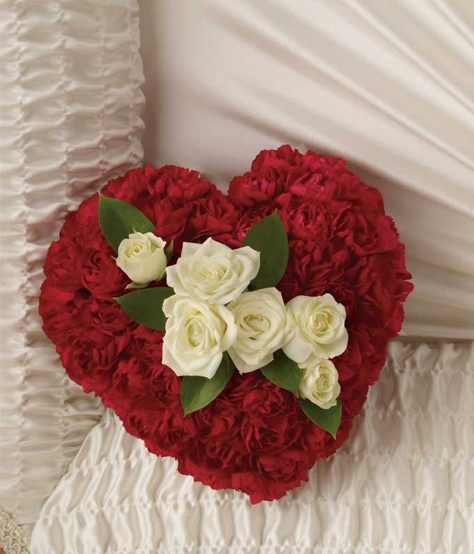 Heart-Shaped Flower Arrangement Including White Spray Roses, Mini Red Carnations and Israeli Ruscus