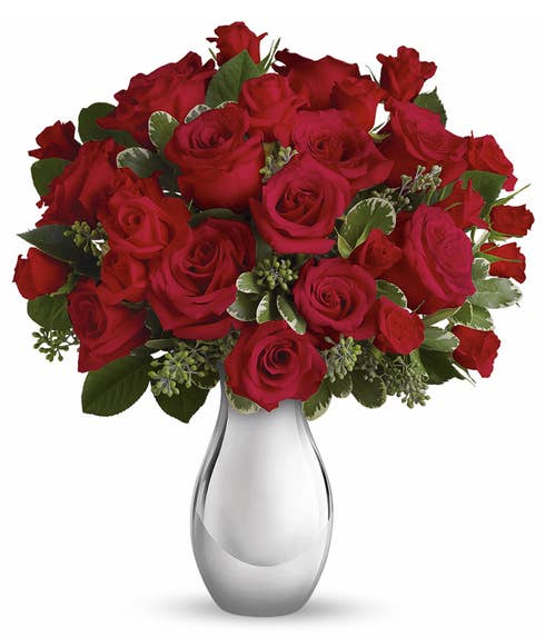 Red and silver flower bouquet with red roses, red spray roses and silver vase