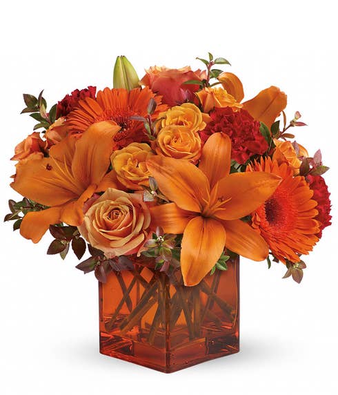 Orange lily, orange gerbera daisy and orange roses bouquet in orange vase