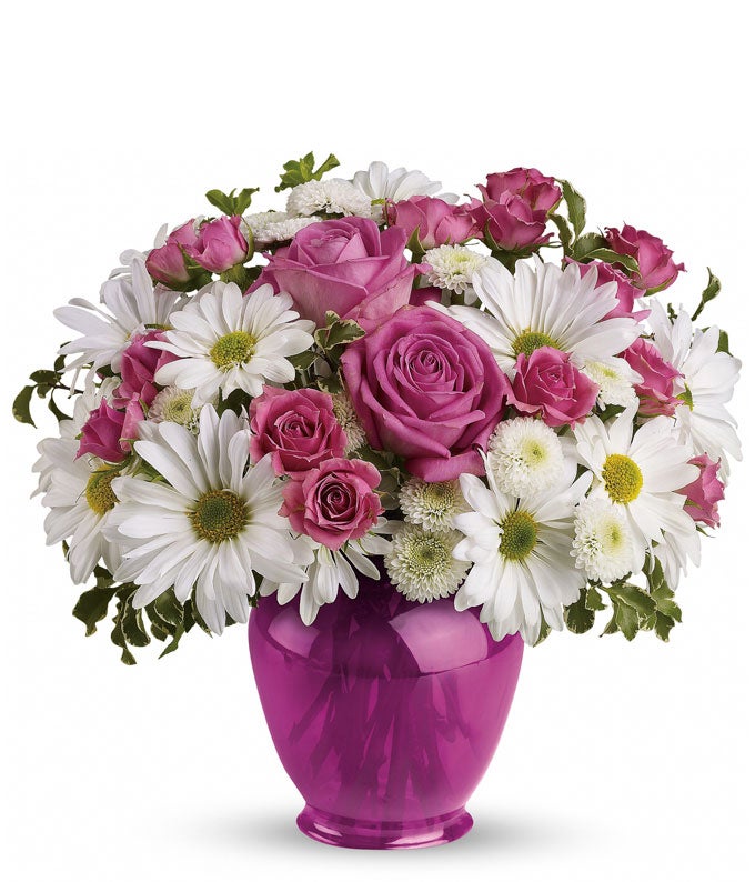 A Bouquet of Pink Spray Roses, White Daisy Chrysanthemums, Lush Greens, and Mini Pink Carnations in a Fuchsia Ginger Jar