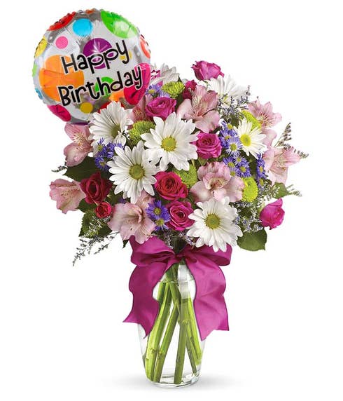 White daisy pink flower and balloon bouquet with pink ribbon, flowers in a vase