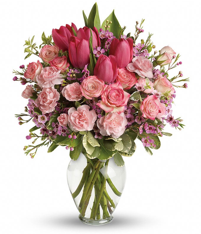 A Bouquet of  Pink Roses, Hot-Pink Tulips, Pale-Pink Carnations, Pitta Negra, Variegated Pittosporum, and Waxflower in a Glass Vase