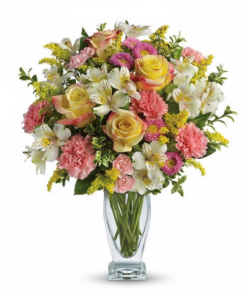 Pastel yellow rose bouquet with pink carnations, white alstroemeria and Easter flowers