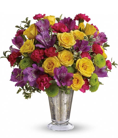 Multicolor flower bouquet of yellow roses, purple alstromeria and sparkle silver vase