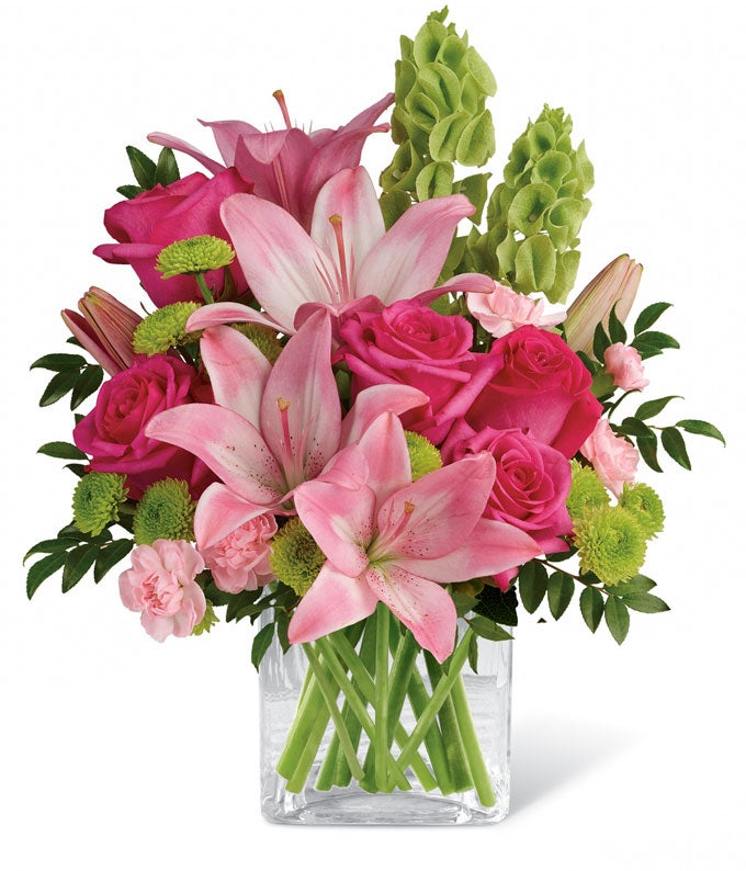 A Bouquet of Dark Pink Roses, Pink Asiatic Lilies, Pink Mini Carnations, Bells of Ireland, Green Button Spray Chrysanthemums, and Huckleberry in a Cube Vase with Personalized Card Message