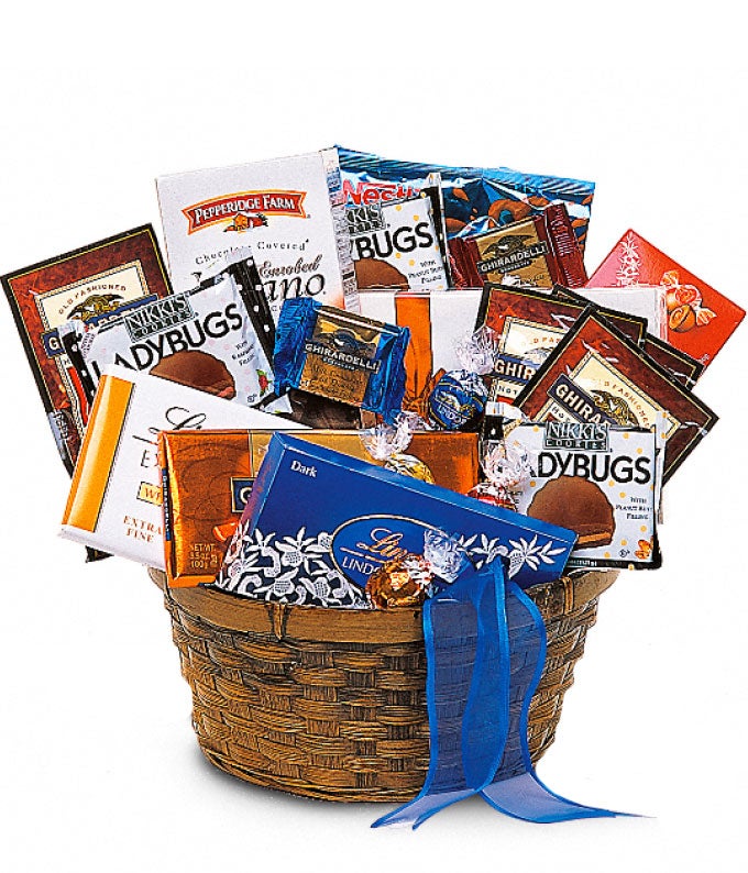 Lindt Lindor Balls, Truffle, Truffle Bar, Nikki's Cookies Ladybugs, Pepperidge Farm Milano Cookies, Russell Stover Chocolates, Hot Chocolate Packets, Chocolate-Covered Pretzels and Ghiradelli Bars And Squares in a Woven Container with Blue Ribbon