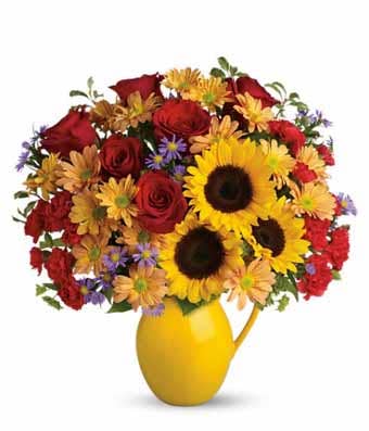 A Bouquet of Sunflowers, Red Roses, Red Carnations, Brown Daisy Mums and Lavender Monte Cassino Asters in a Ceramic Yellow Pitcher