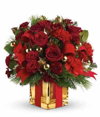 Red roses, red carnations and a gold square vase with a ribbon