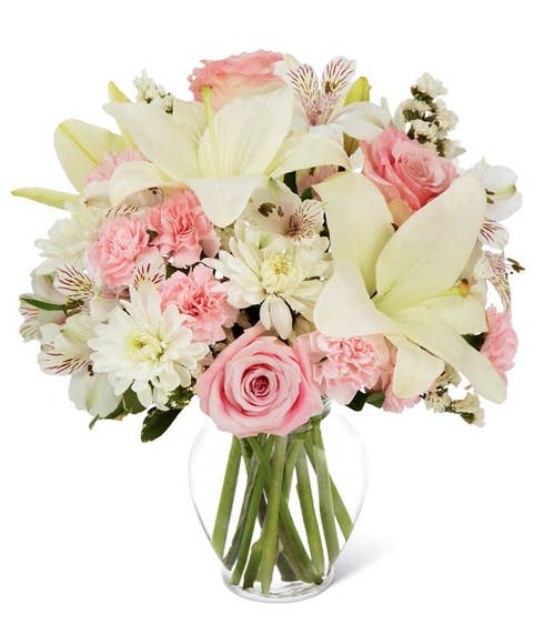 White Asiatic and pink Peruvian lily bouquet with statice and pink carnations