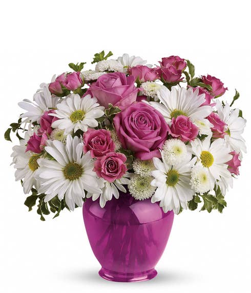 Pink rose and white daisy chrysanthemum bouquet with ginger jar