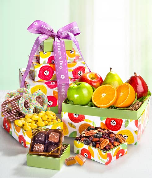 Mother's Day Gift Basket: Green D'Anjou Pear, Red D'Anjou Pear, Navel Orange, Braeburn Apple, Granny Smith Apple, Gourmet Brownies, Cherry Berry Trail Mix, Lemon Crème Almonds, Milk & Dark Chocolate Sea Salt Caramels. Adorned with a 