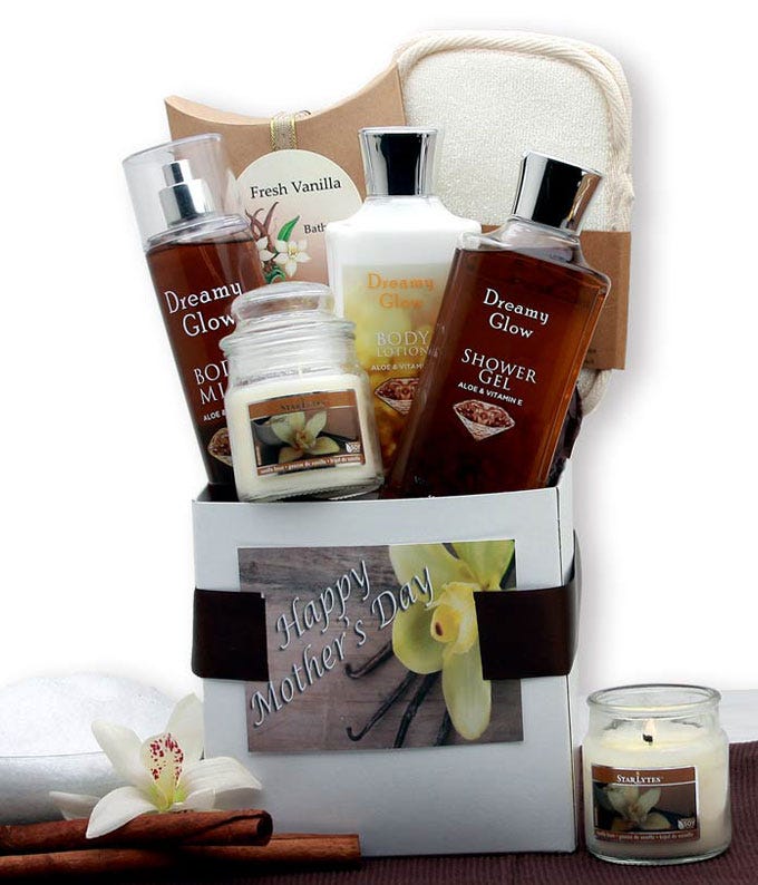 Mother's Day gift basket with vanilla body lotion, bath gel, body spray, bath salts, wax melts, and bath sponge in a gift box with a bow and 